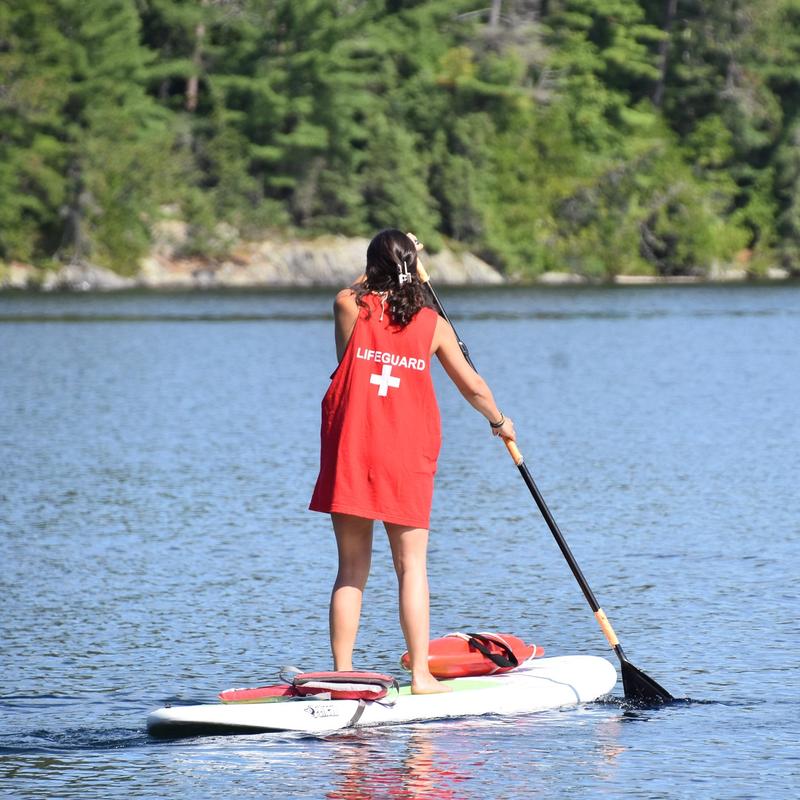 international camp counsellor working as a lifeguard at canadian adventure camp