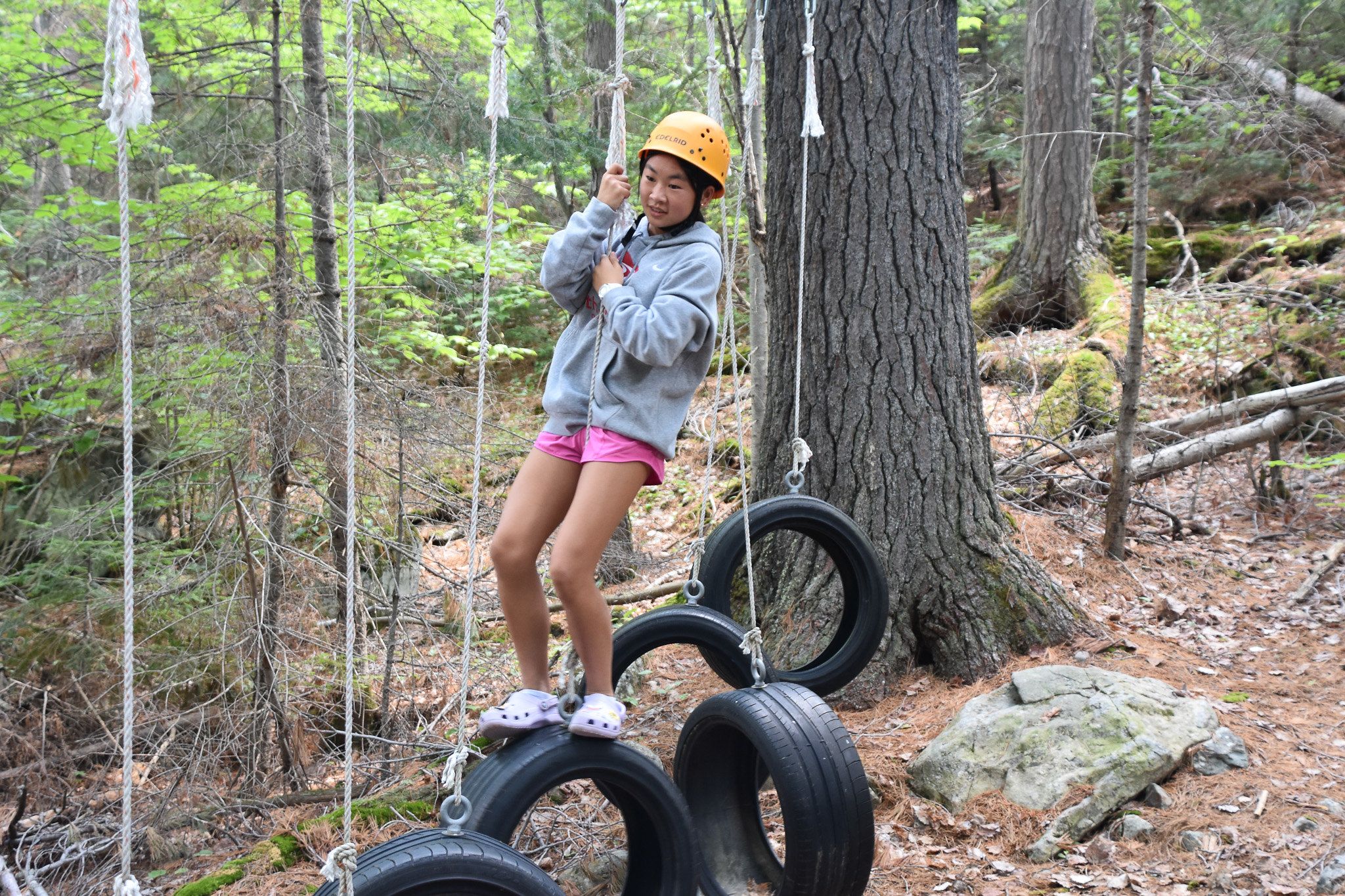 camper on the low ropes course