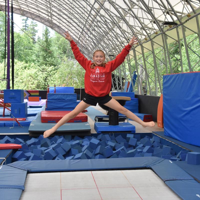 camper training in the trampoline program at Canadian Adventure Camp