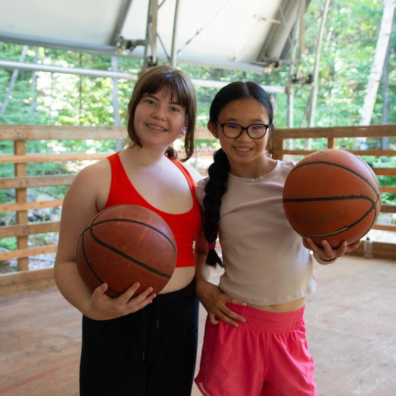 Campers at basketball, smiling at Canadian Adventure Camp
