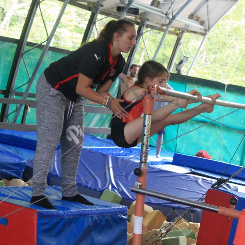 gymnastics coach training a camper at Canadian Adventure Camp