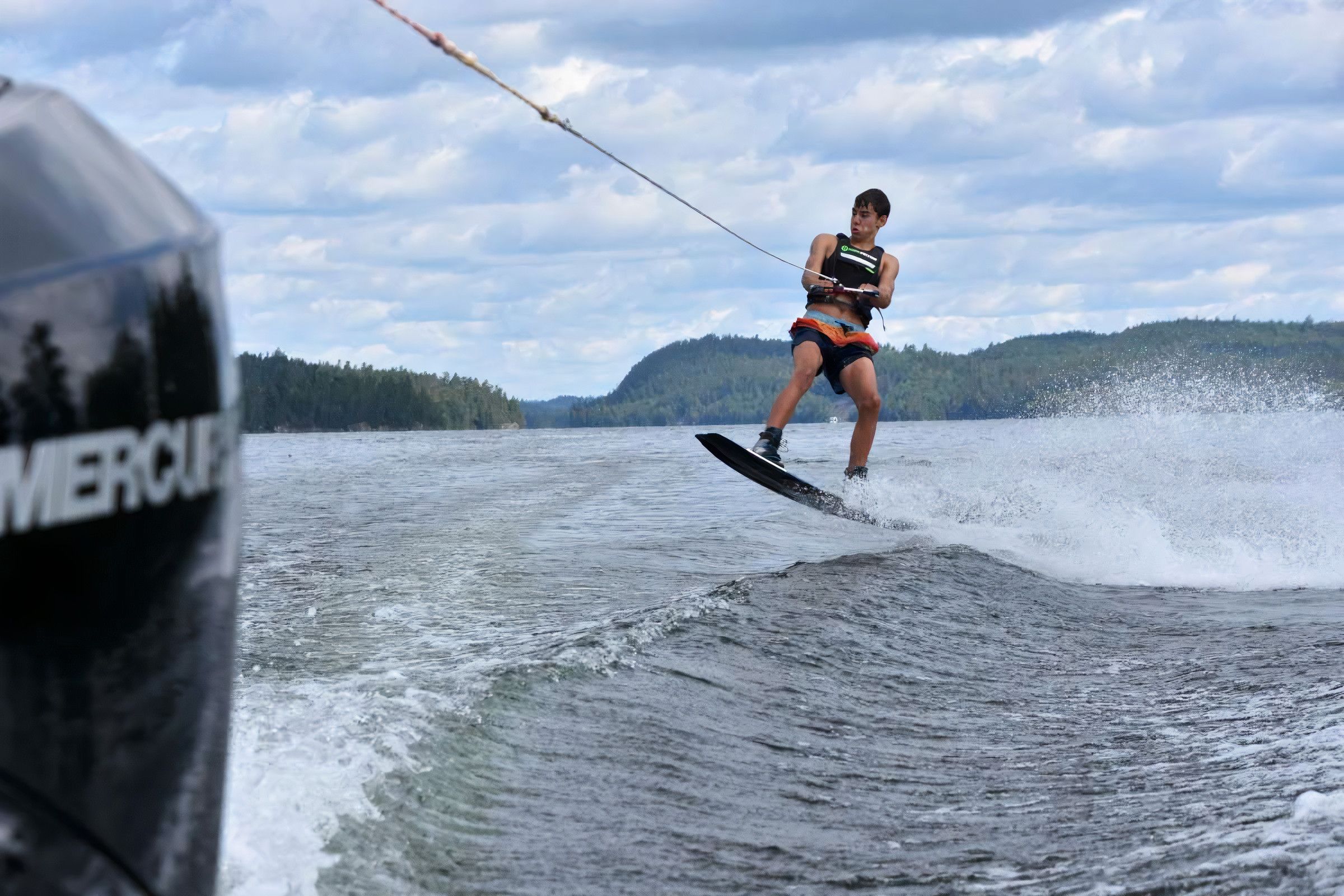 camper wakeboarding on the lake at Canadian Adventure Camp