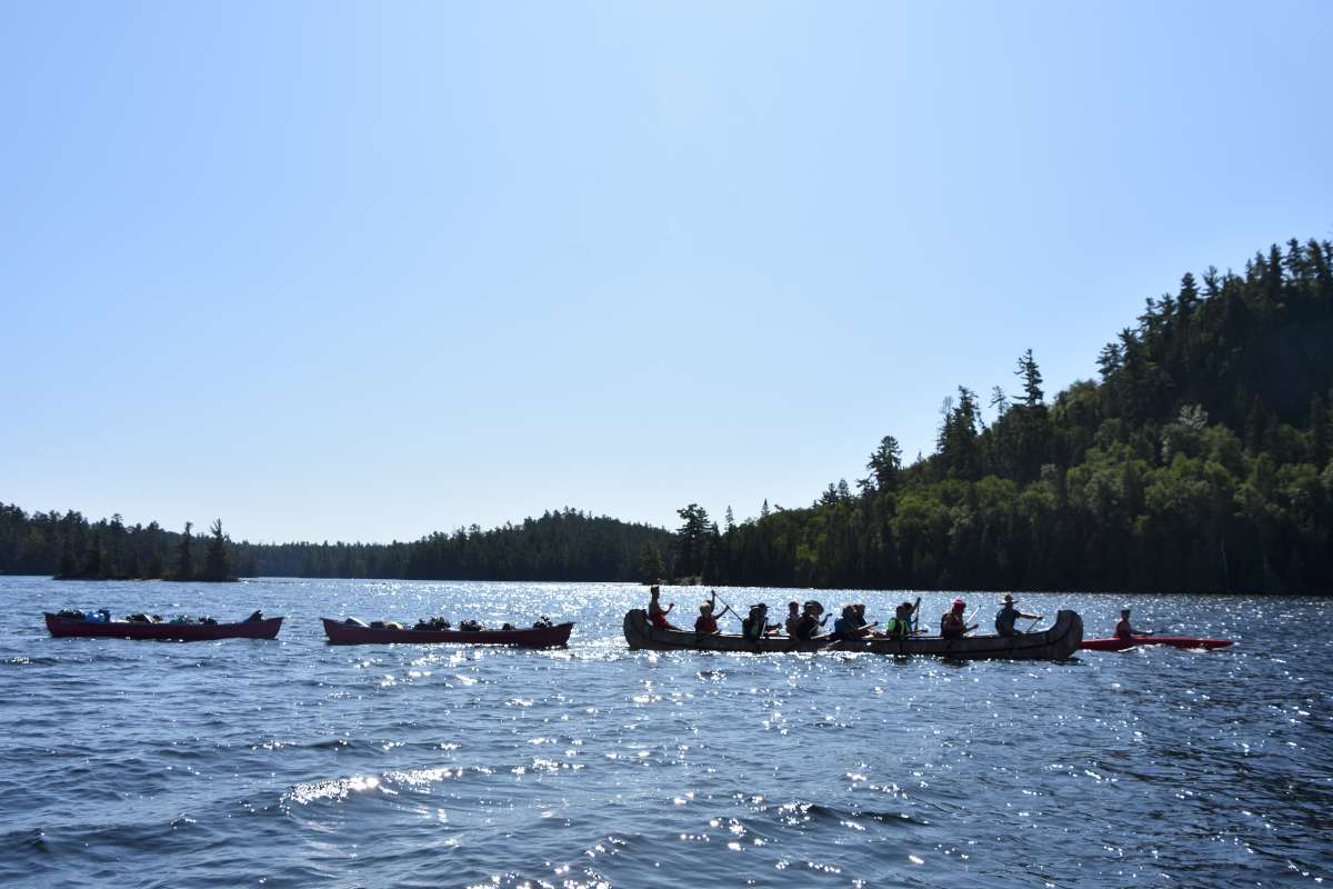 war canoe on the lake at Canadian Adventure Camp