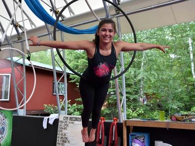 camper on the hoop in the aerials program at Canadian Adventure Camp