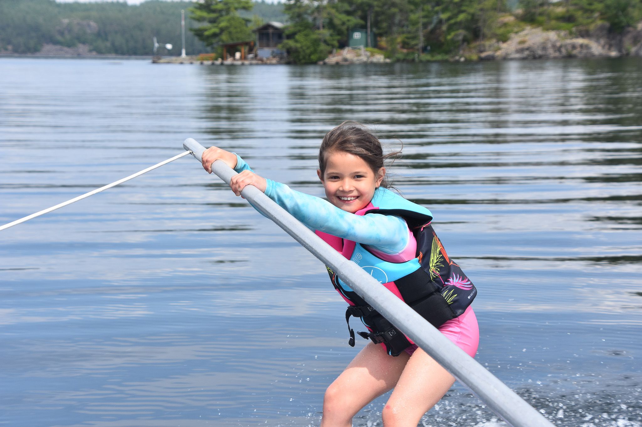 Young camper learning to waterski