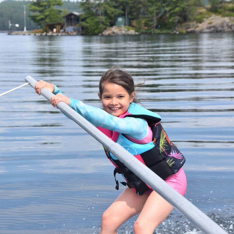 Young camper learning to waterski