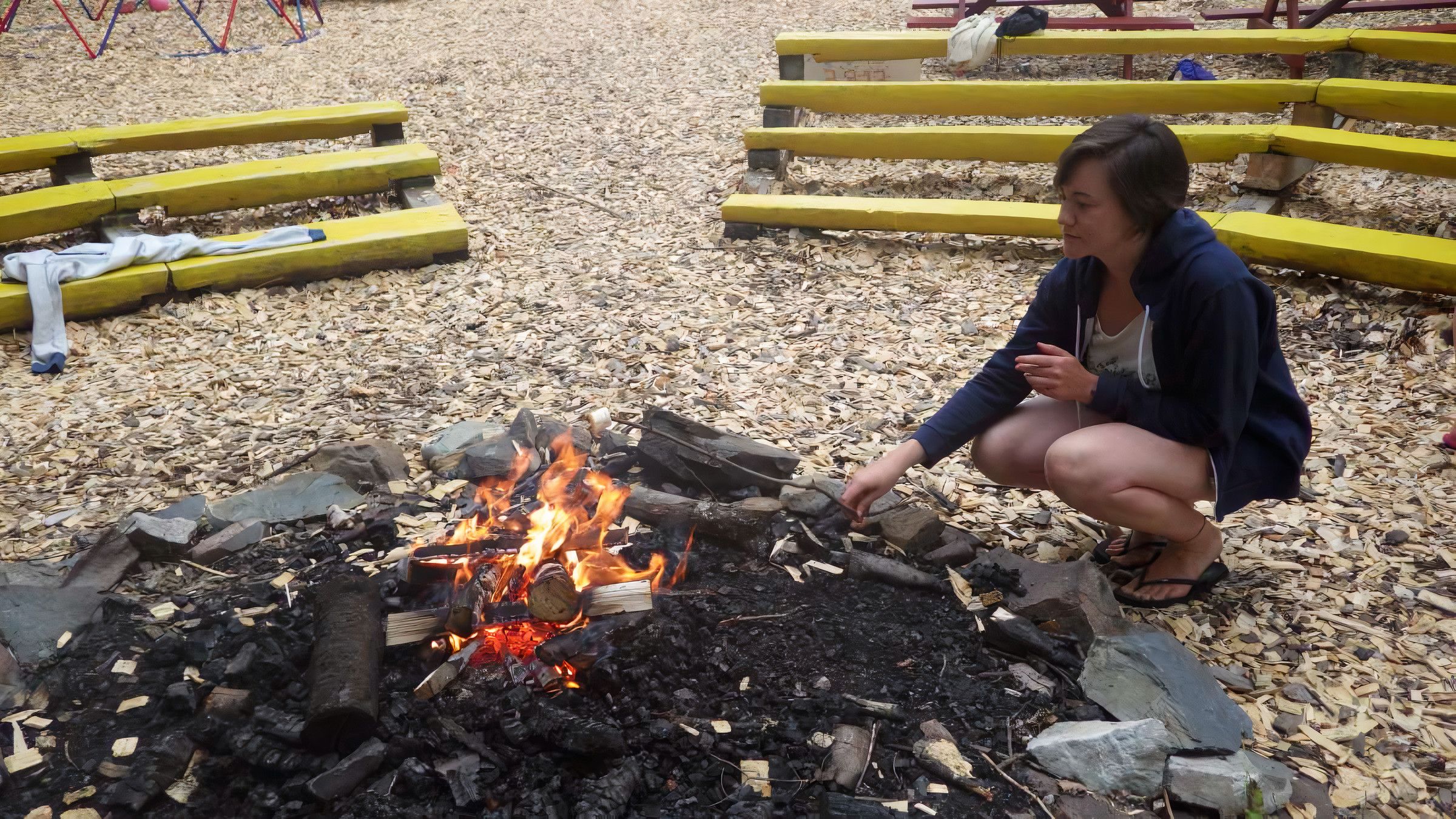 staff lighting a campfire at Canadian Adventure Camp