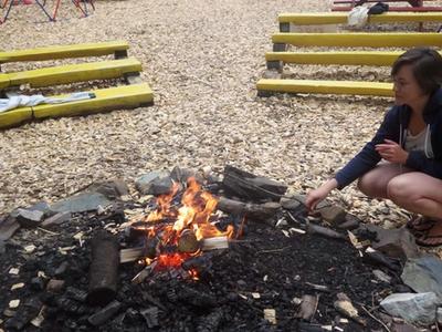 staff lighting a campfire at Canadian Adventure Camp