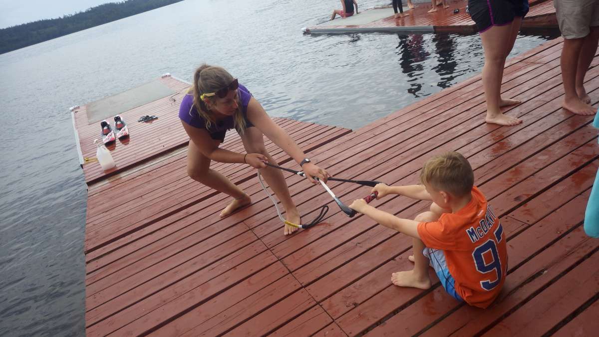 waterski coaching coaching younger camper in the waterski program at Canadian Adventure Camp