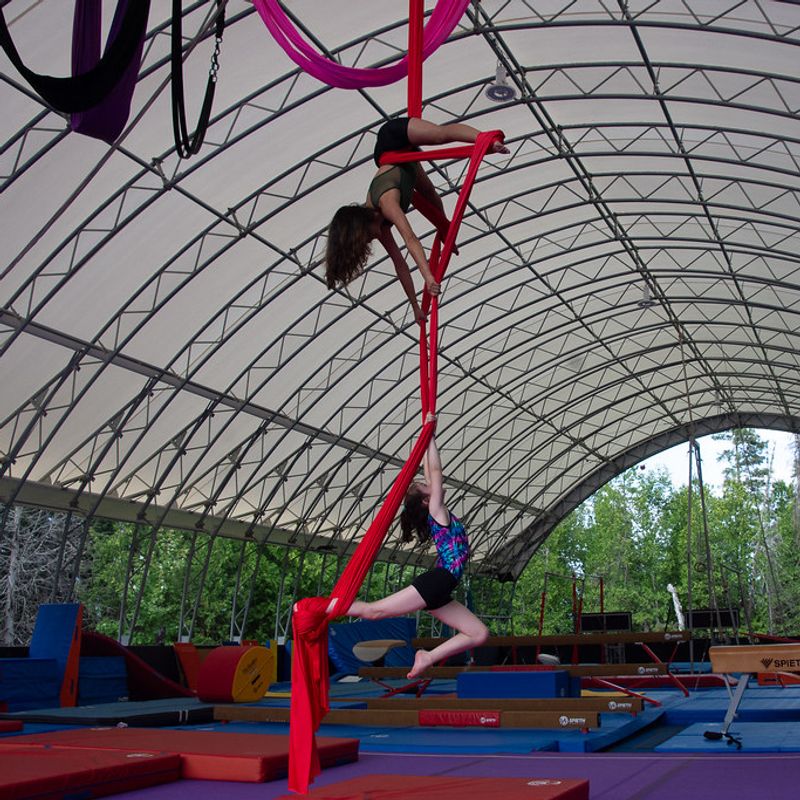 Aerials coach with a camper on the hoop at Canadian Adventure Camp