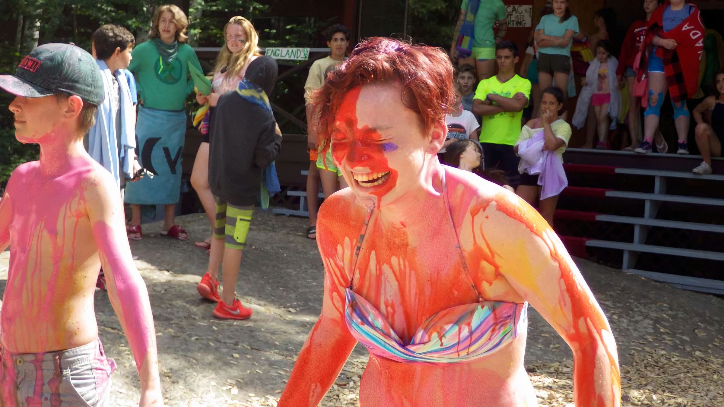 camper covered in paint laughing at Canadian Adventure Camp