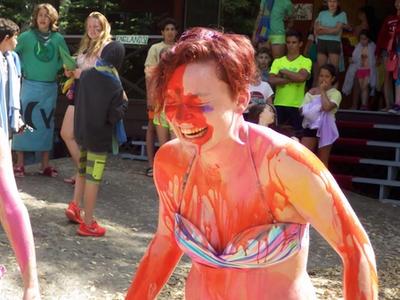 camper covered in paint laughing at Canadian Adventure Camp