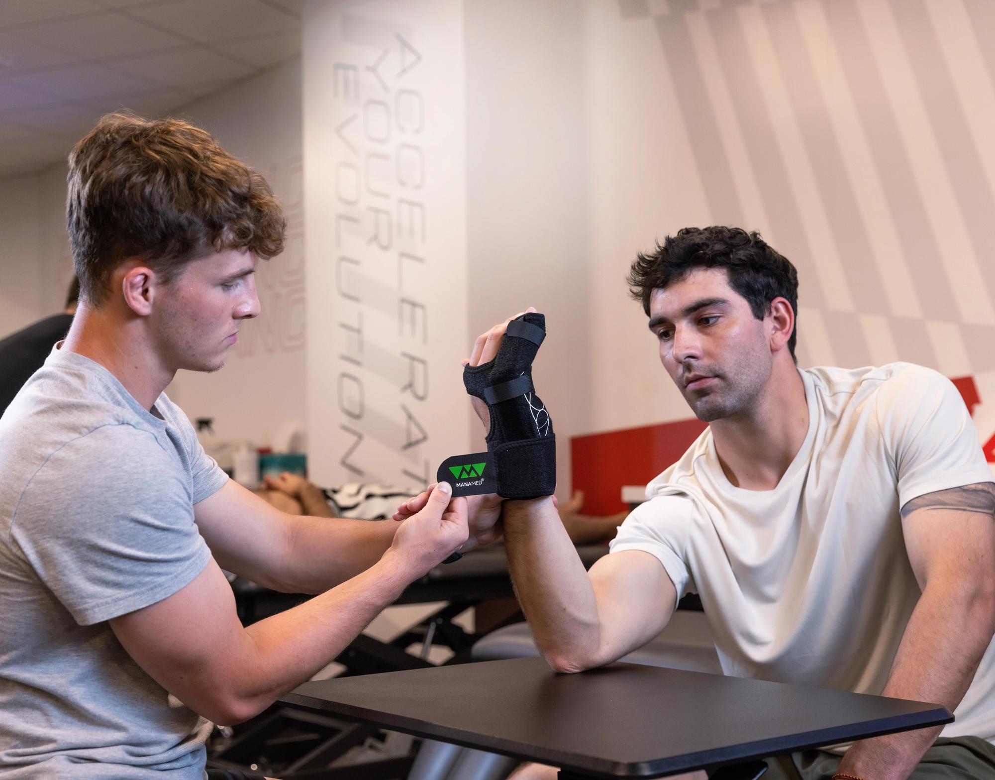 The ManoFX brace on an athlete at at trainers table.