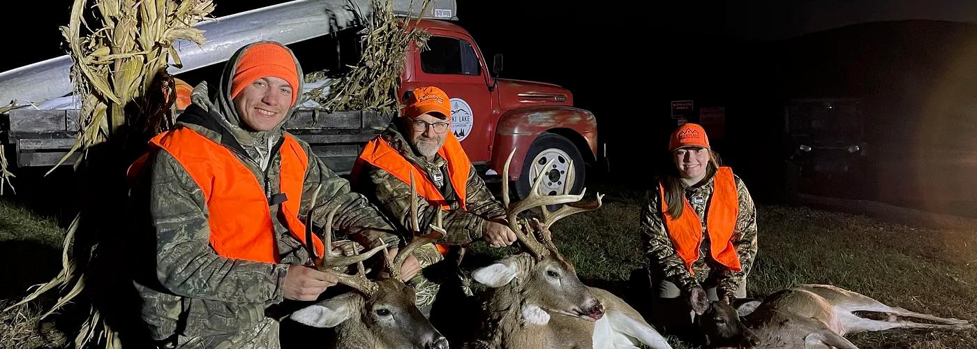 Mature whitetail buck in a Missouri hardwood forest during a guided deer hunt.