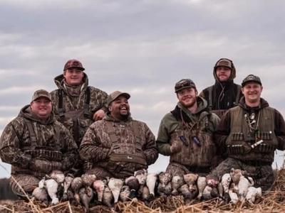 Duck hunters in a flooded field during a waterfowl hunt