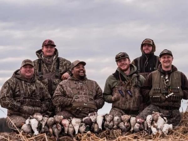 Duck hunters in a flooded field during a waterfowl hunt