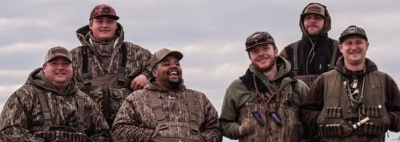 Duck hunters in a flooded field during a waterfowl hunt