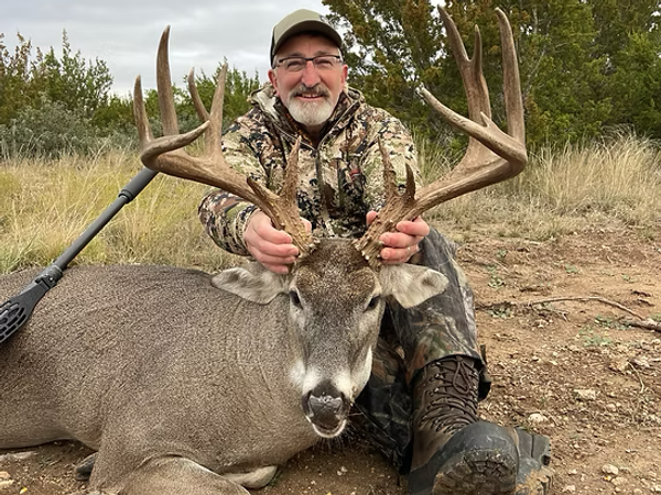 Hunter with Texas Whitetail Deer