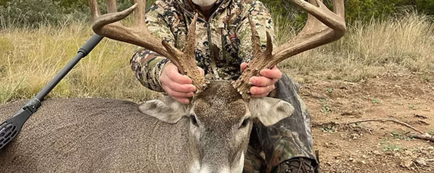 Hunter with Texas Whitetail Deer