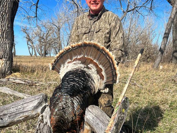Hunter with Merriam's Wild Turkey in Montana
