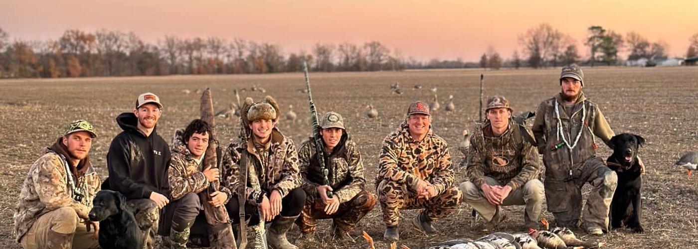 Hunters with geese during an Arkansas goose and duck hunt.