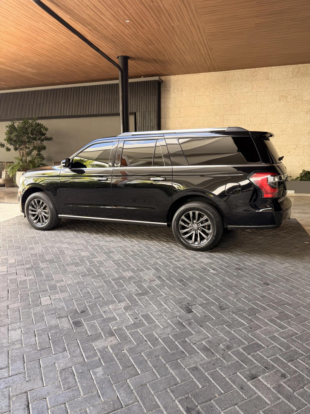 CJ Transfer private driver welcoming guests at night for Punta Cana dinner shows and nightlife transport
