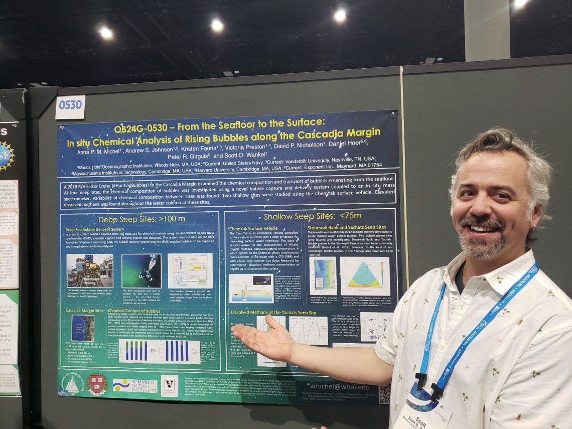 Man showing science poster