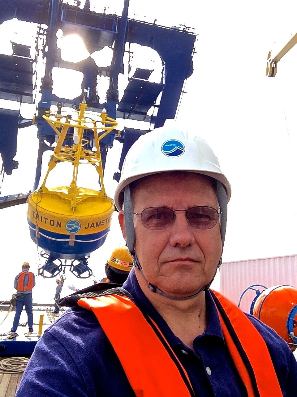 Expedition chief scientist Kelvin Richards during deployment of a data buoy during a previous expedition. 