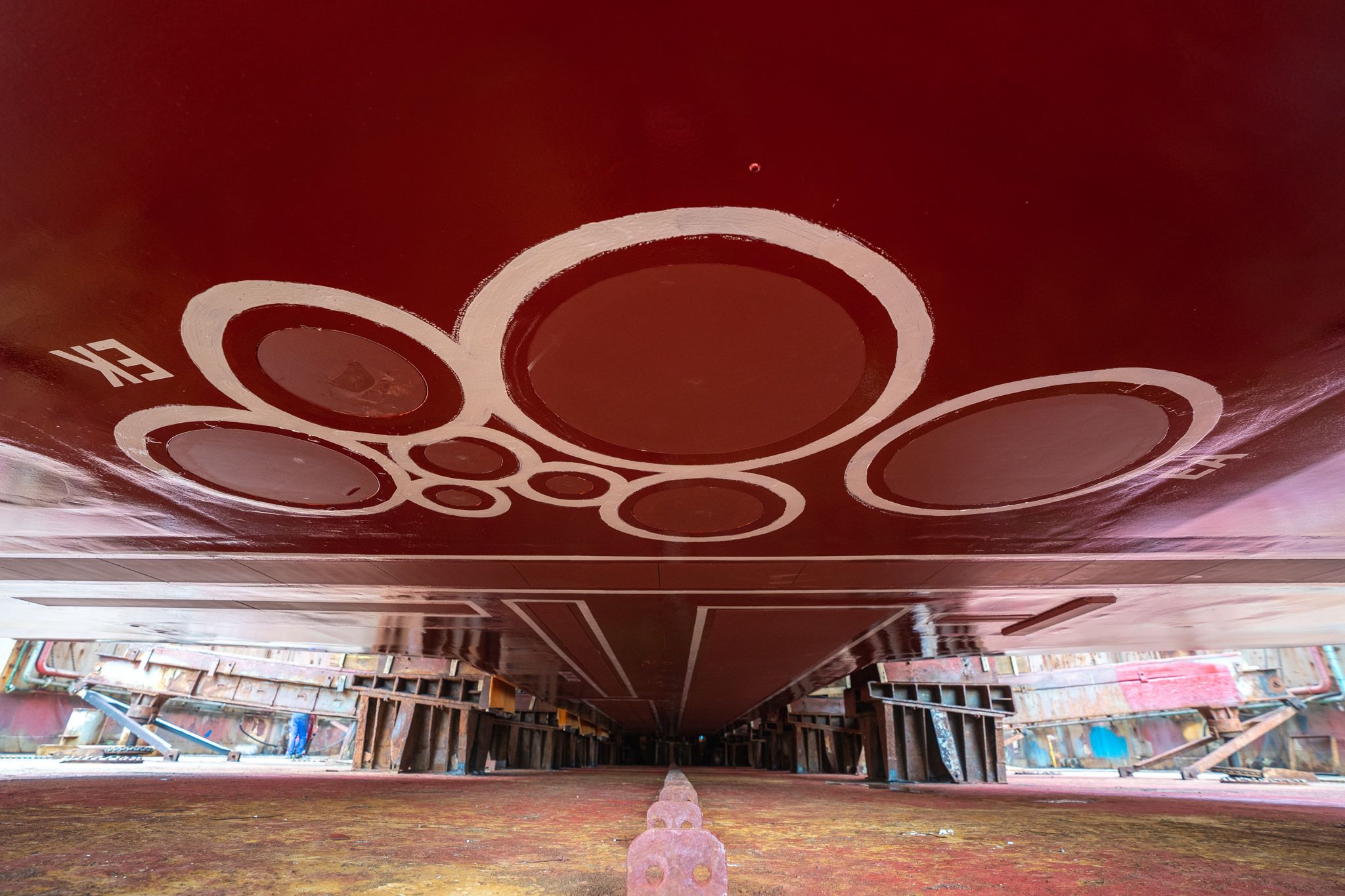Photo of underneath the ship while the ship is out of the water, showing the sonar faces.