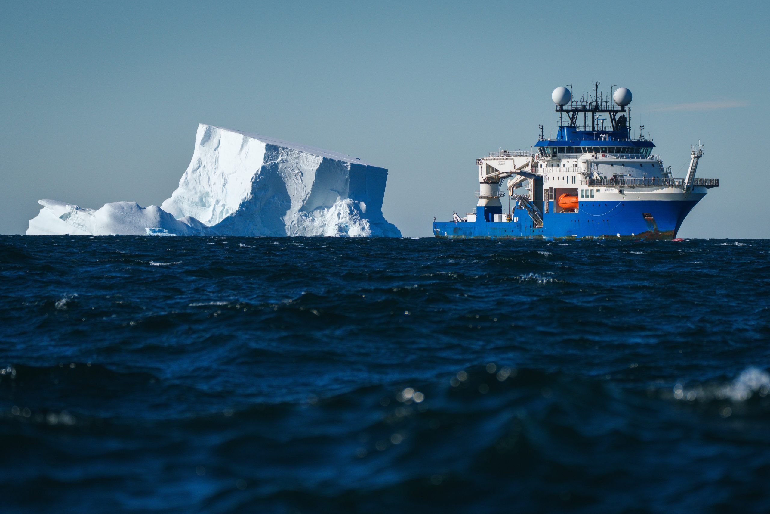 Research Vessel Falkor (too) maneuvers around icebergs while conducting research in the Bellingshausen Sea off Antarctica.