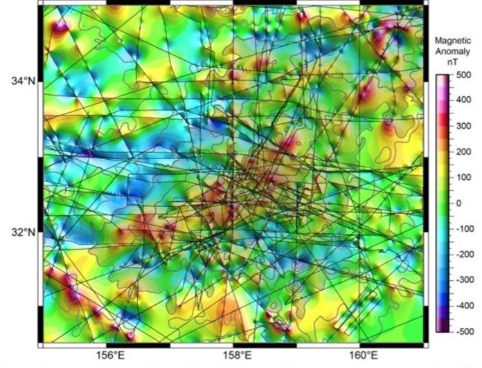 Magnetic anomalies over Tamu Massif. Colors indicate magnetic anomaly values. Thin lines are ship tracks. Gray contours show bathymetry at 500-m intervals and gray shaded levels show Tamu Massif higher than 4500 m and 3000 m (slightly darker).