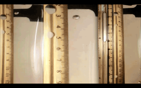 Image shows a bubble hovering in front of laboratory instruments
