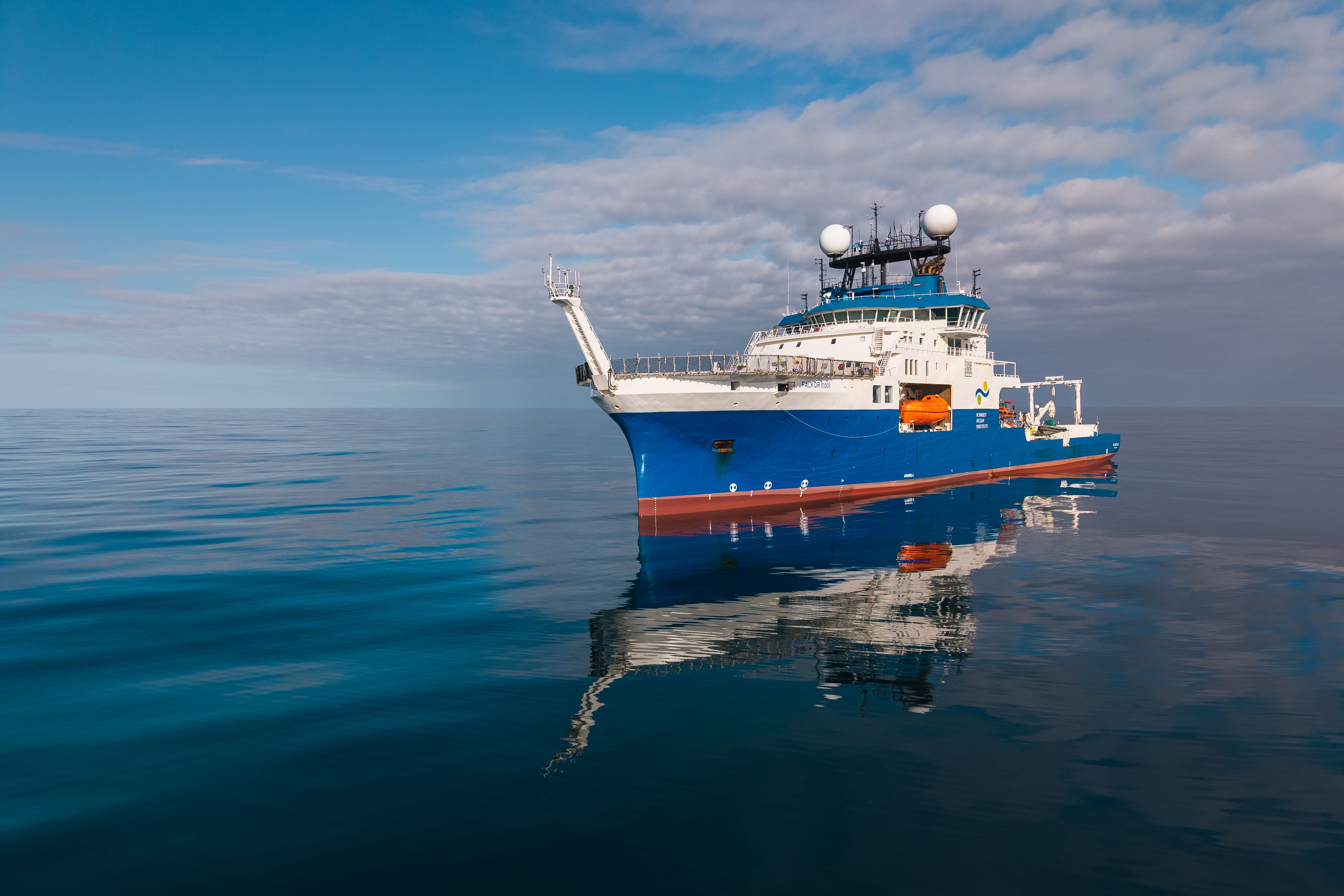 Research Vessel Falkor (too) on a calm ocean