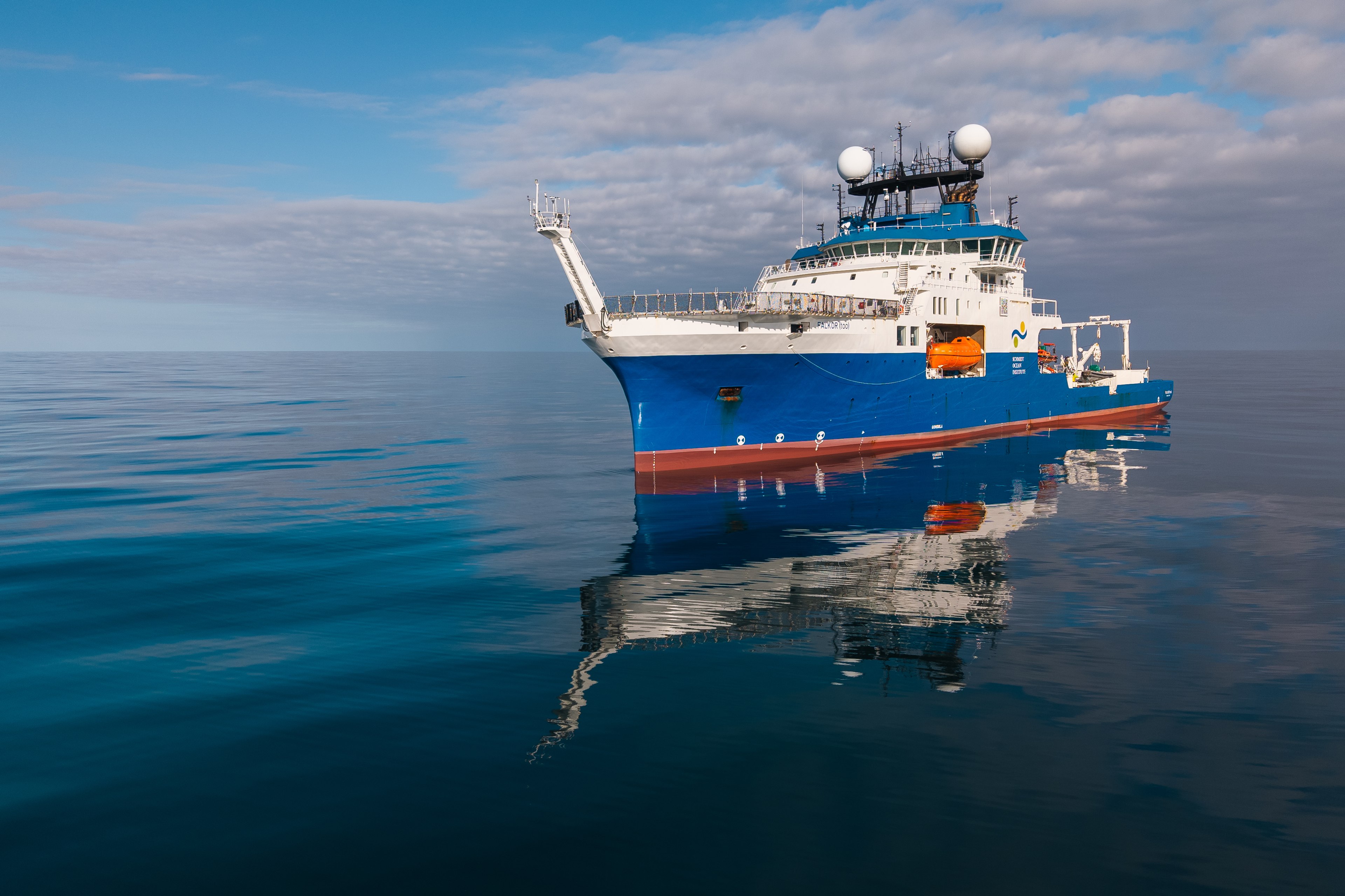 Research Vessel Falkor (too) on a calm ocean