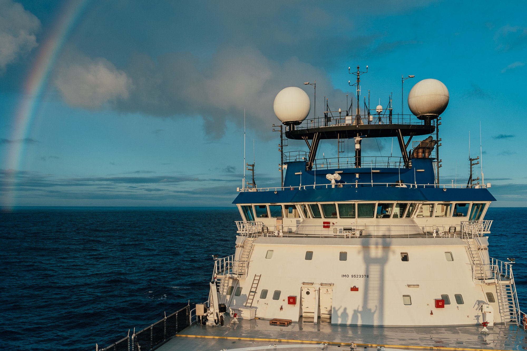 Rainbow over deck of a ship