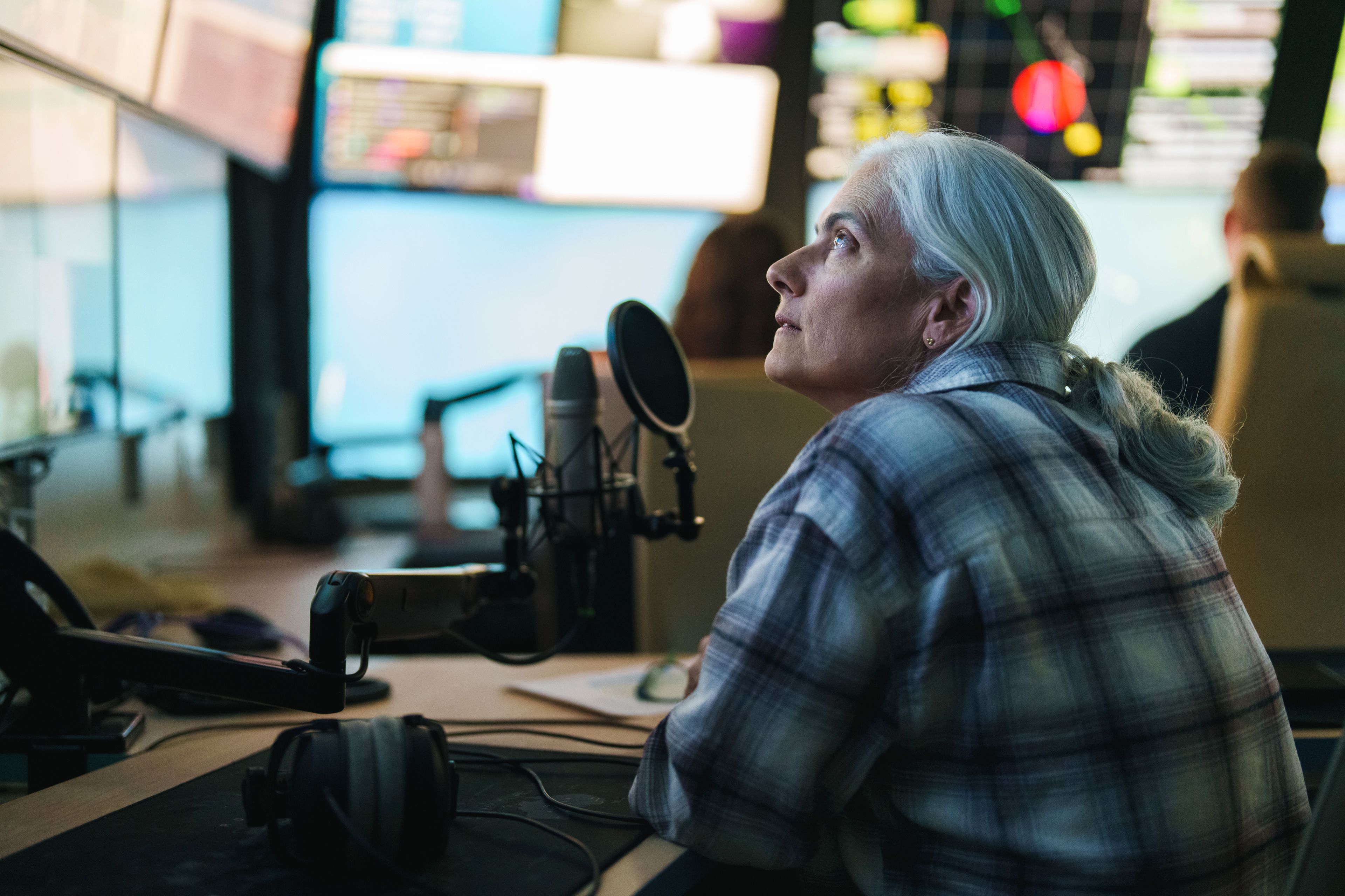 Chief scientist looking at screens in mission control during a dive.