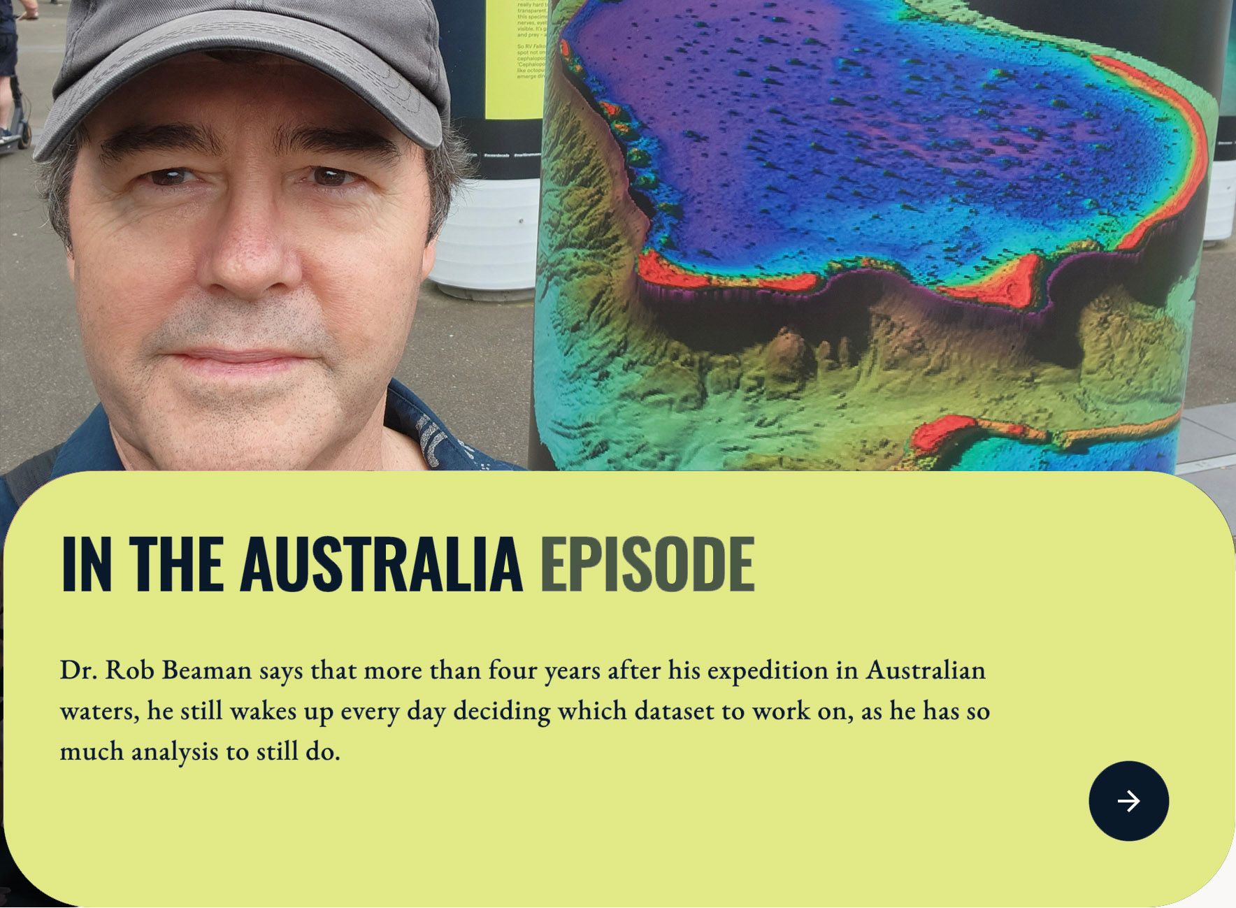 Man standing in front of a sonar map of a reef