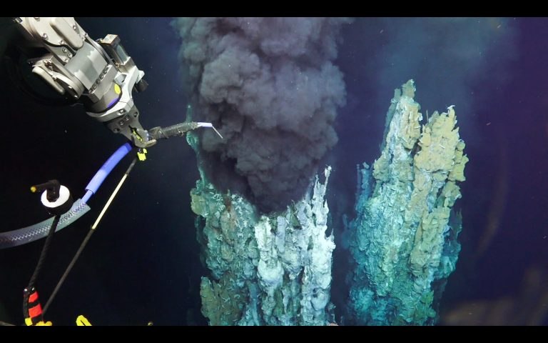 ROV SuBastian takes a fluid sample from a black smoker chimney during the December 2016 expedition.
