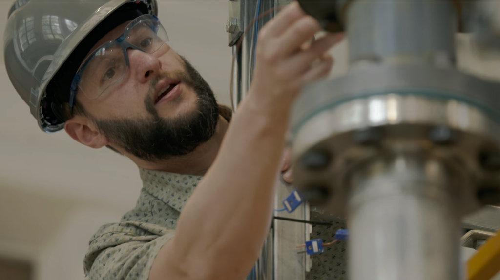 Oklo technician working on fuel cycle equipment