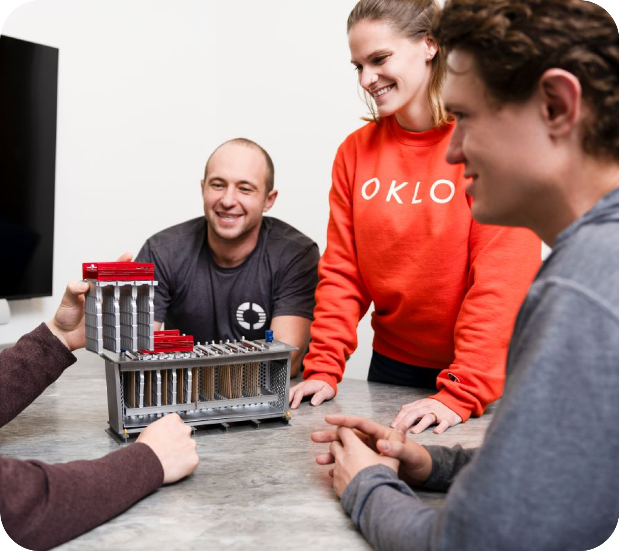 Engineers reviewing a reactor core model