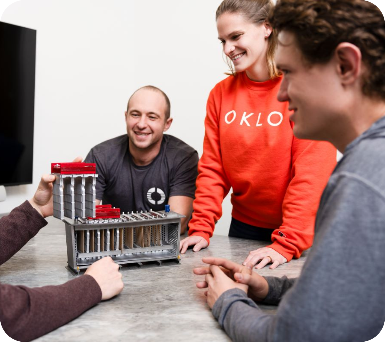 Engineers reviewing a reactor core model