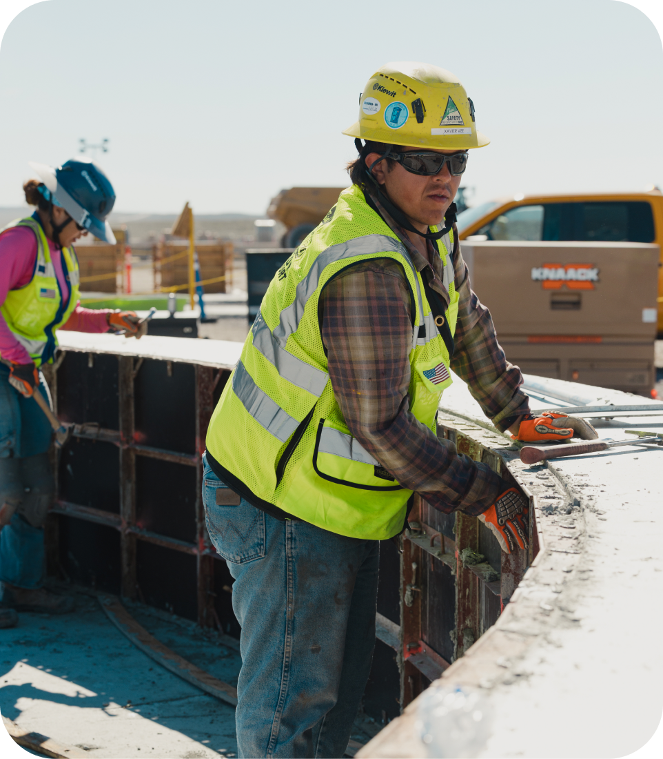 Construction crew placing rebar on site