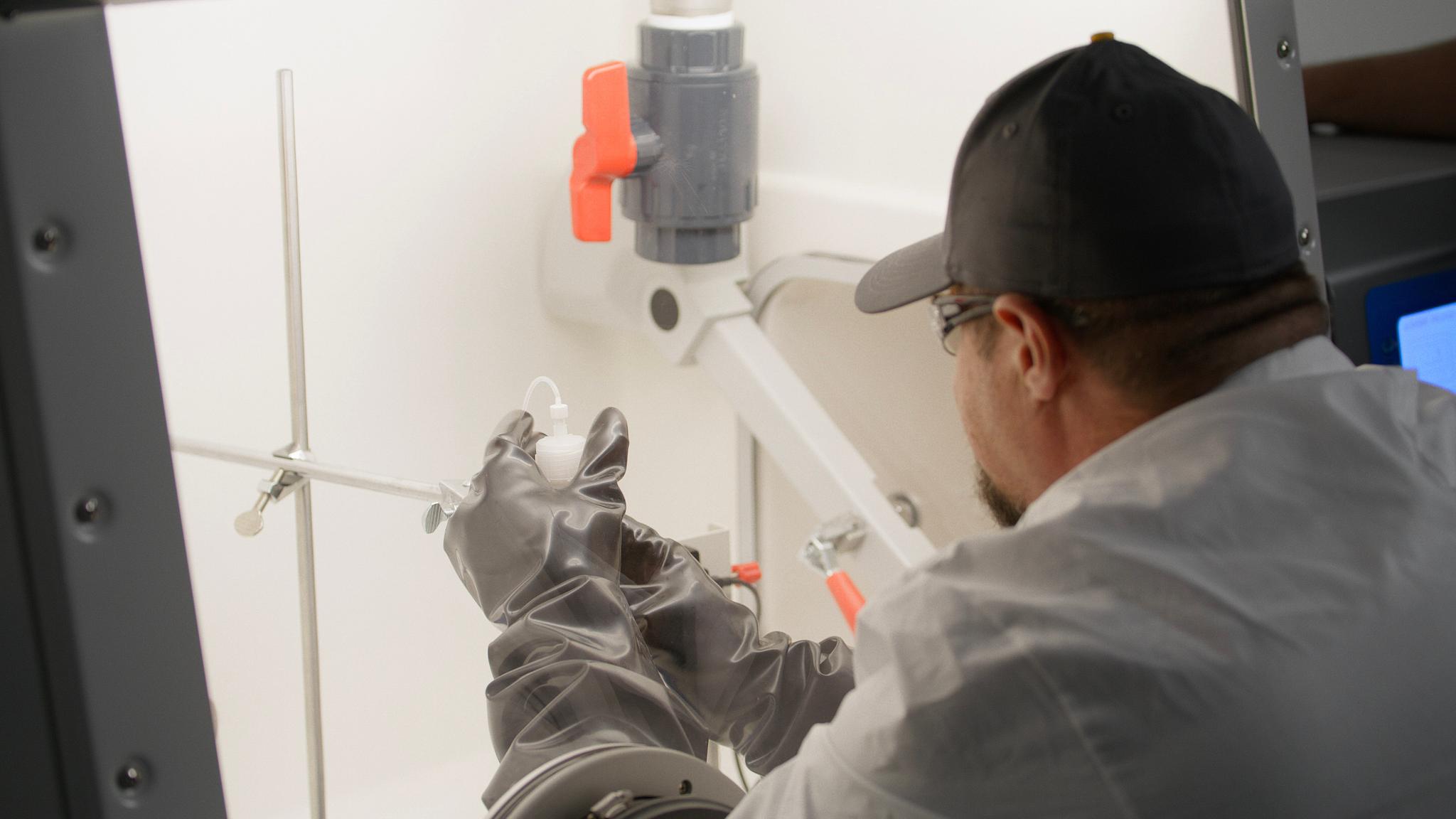Technician working in an isotope production lab