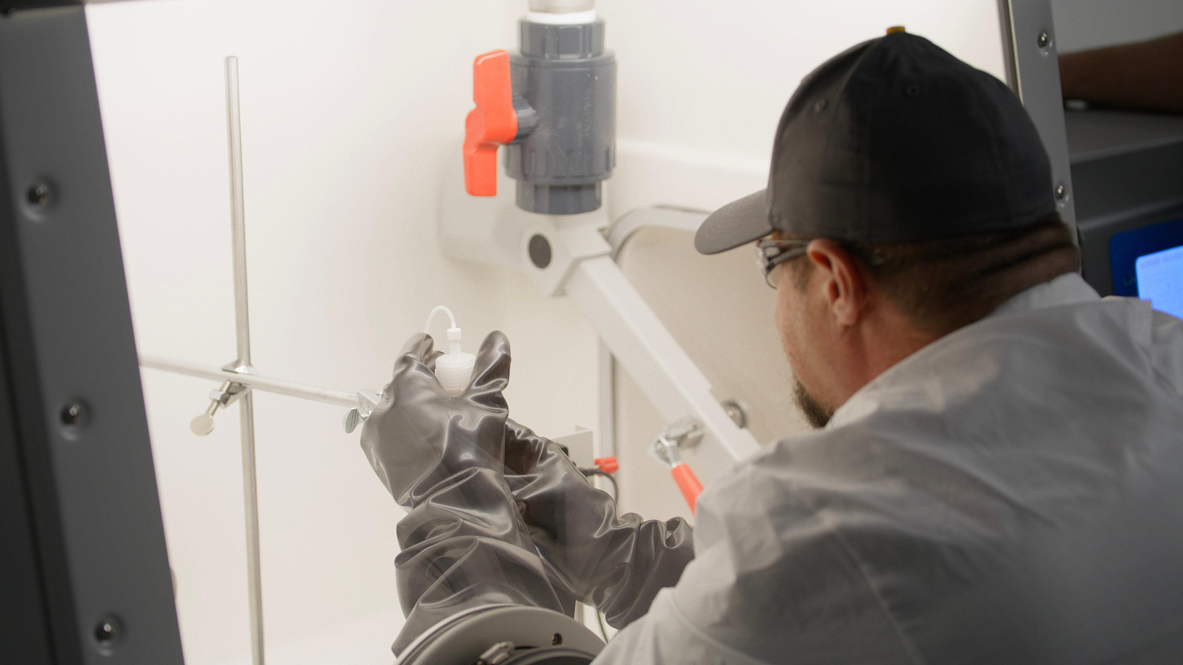 Technician working in an isotope production lab