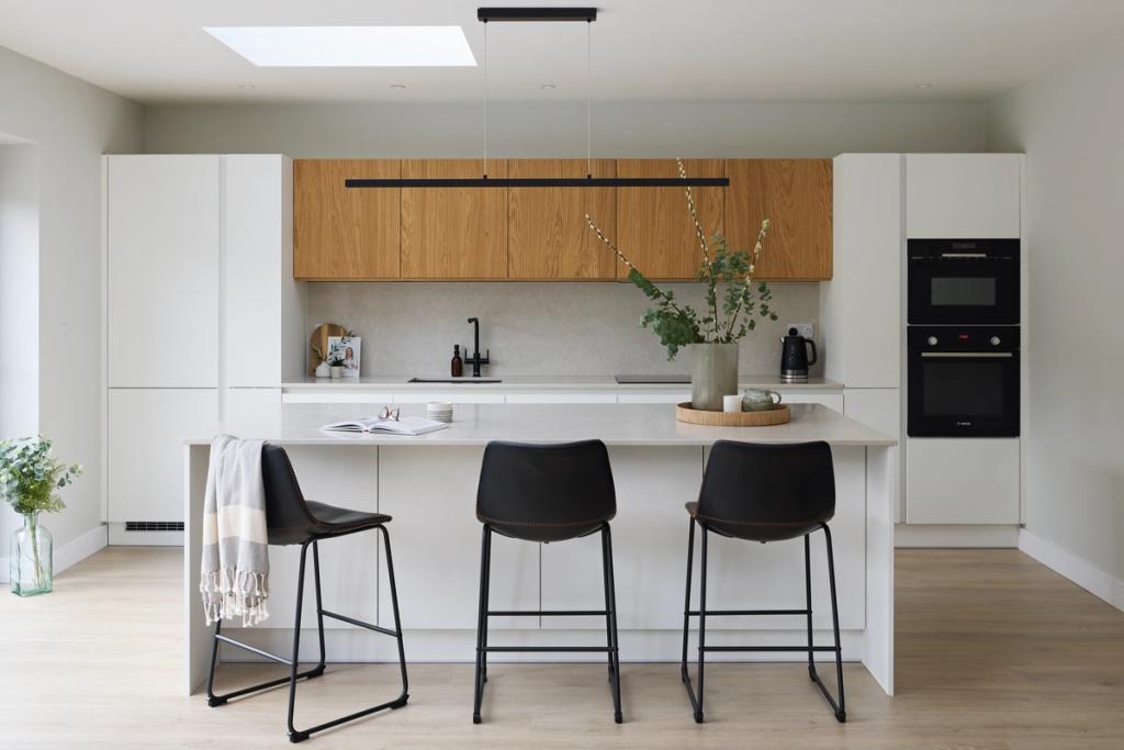 Handleless white kitchen with oak accents
