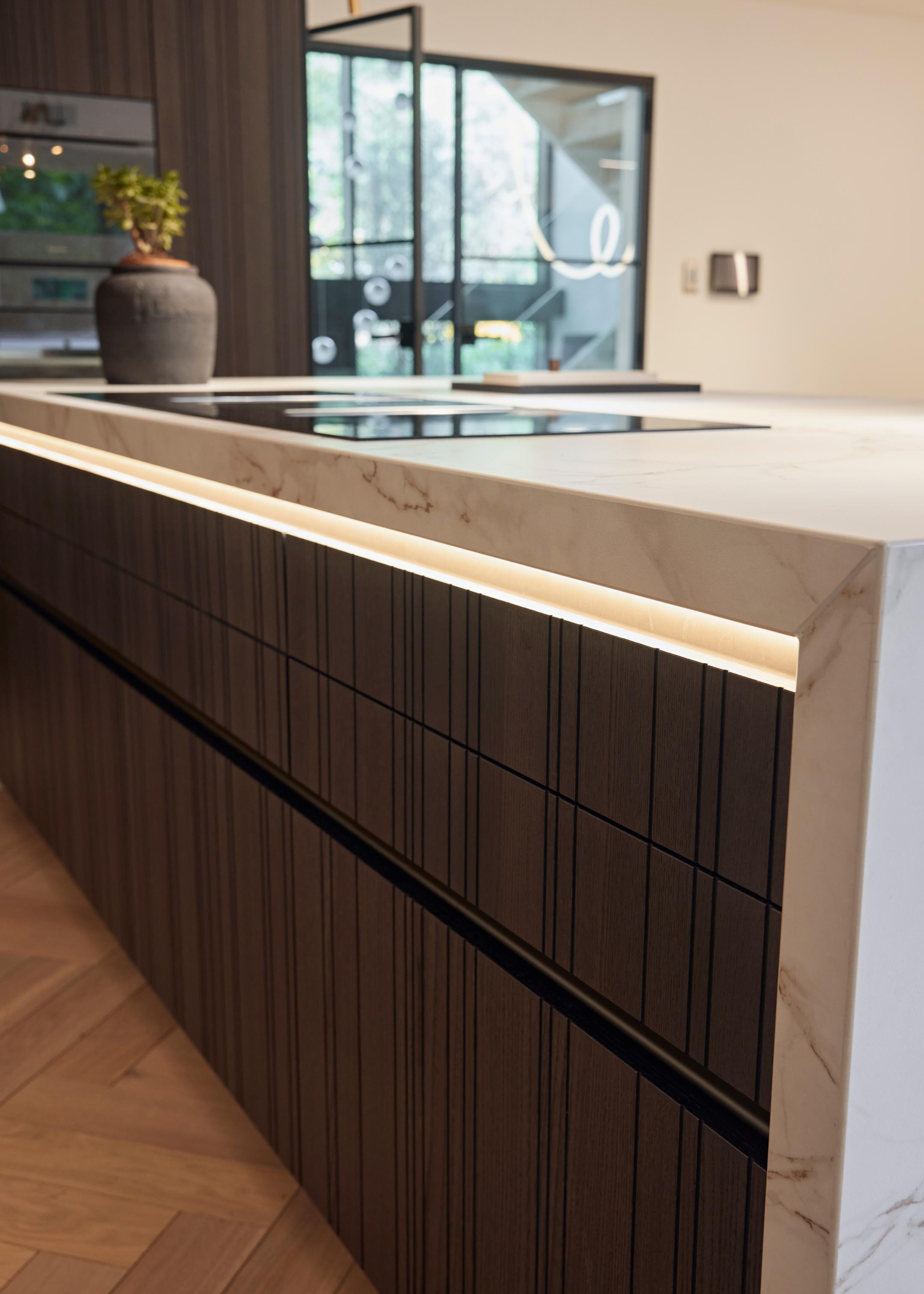 Mitred Dekton waterfall ends with integrated lighting