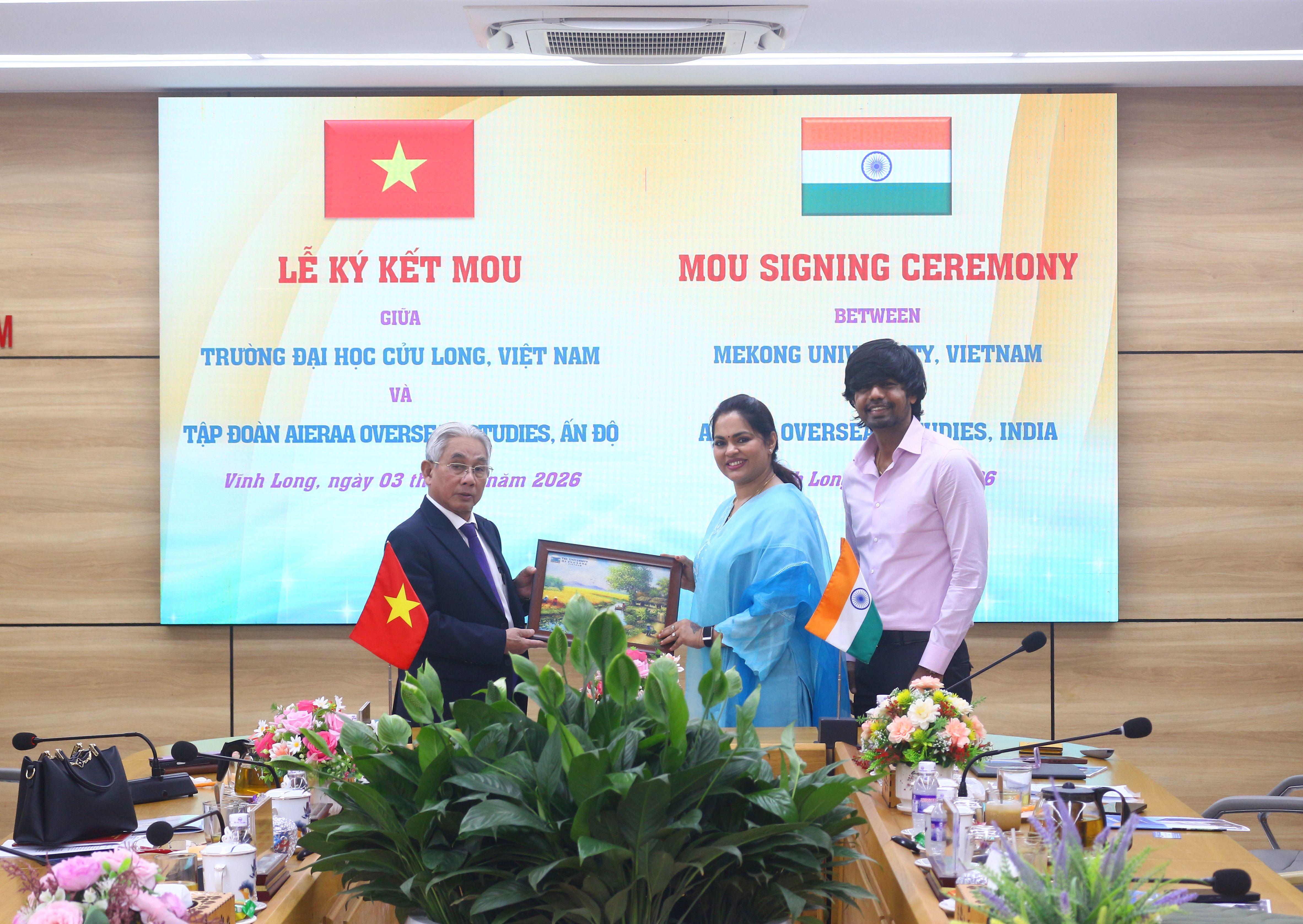 Rector presenting a souvenir gift to Mrs. Deepa Ranganathan
