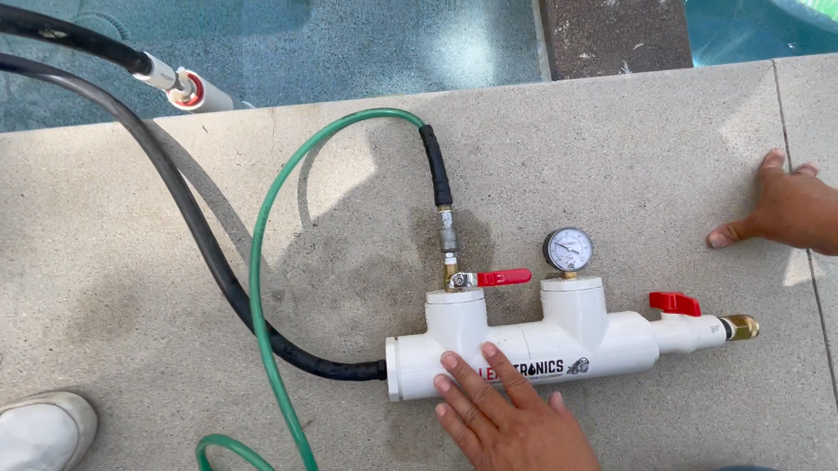 Air pressure test confirming the repaired pipe is holding pressure