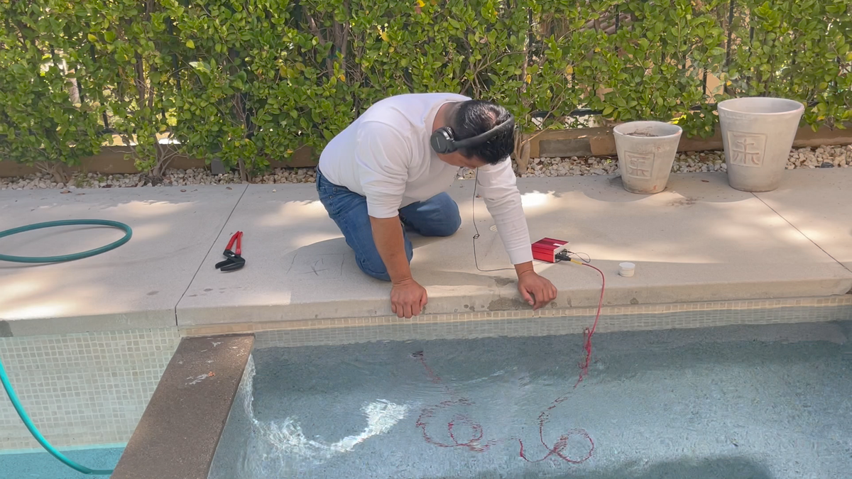 Leak-detection pressure test being set up on pool plumbing