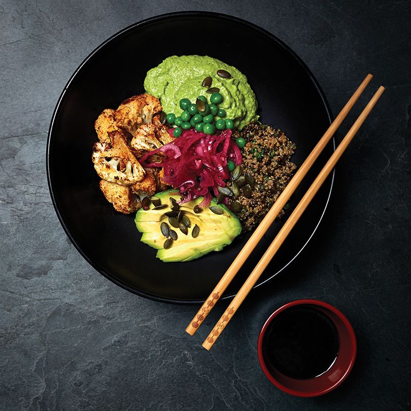Buddha bowl with chipotle cauliflower and pea hummus
